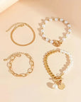 Chic Gold 4-Piece Bracelet Set – Snake, Pearls & Links | Gold